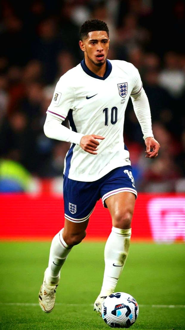 A male soccer player in an England jersey with the number 10 is running on the field, focused on controlling the ball at his feet during a match streamed live on IPTV Latino.